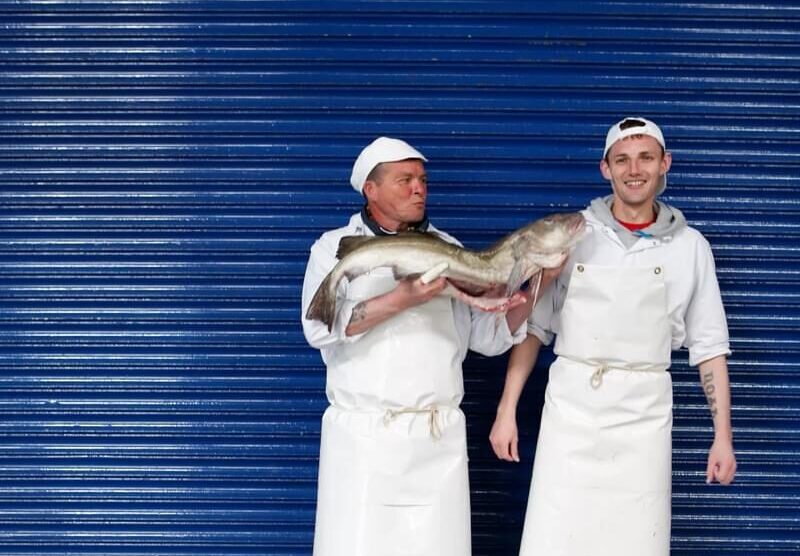 Image of two employees of Welch Fishmongers