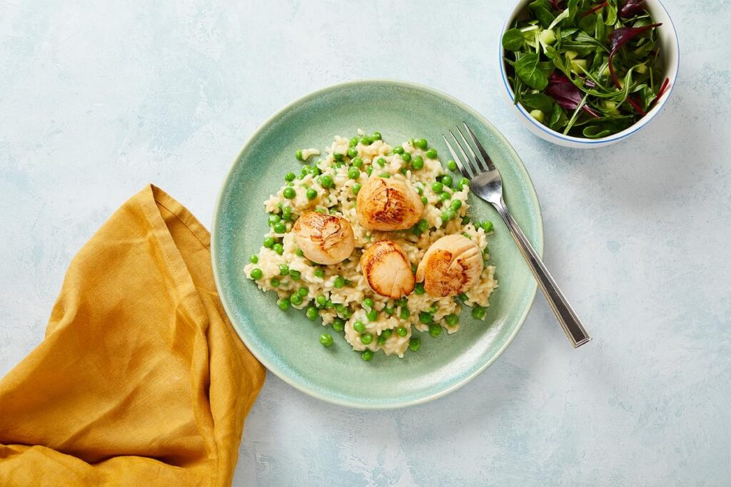 A dish of cooked scallops