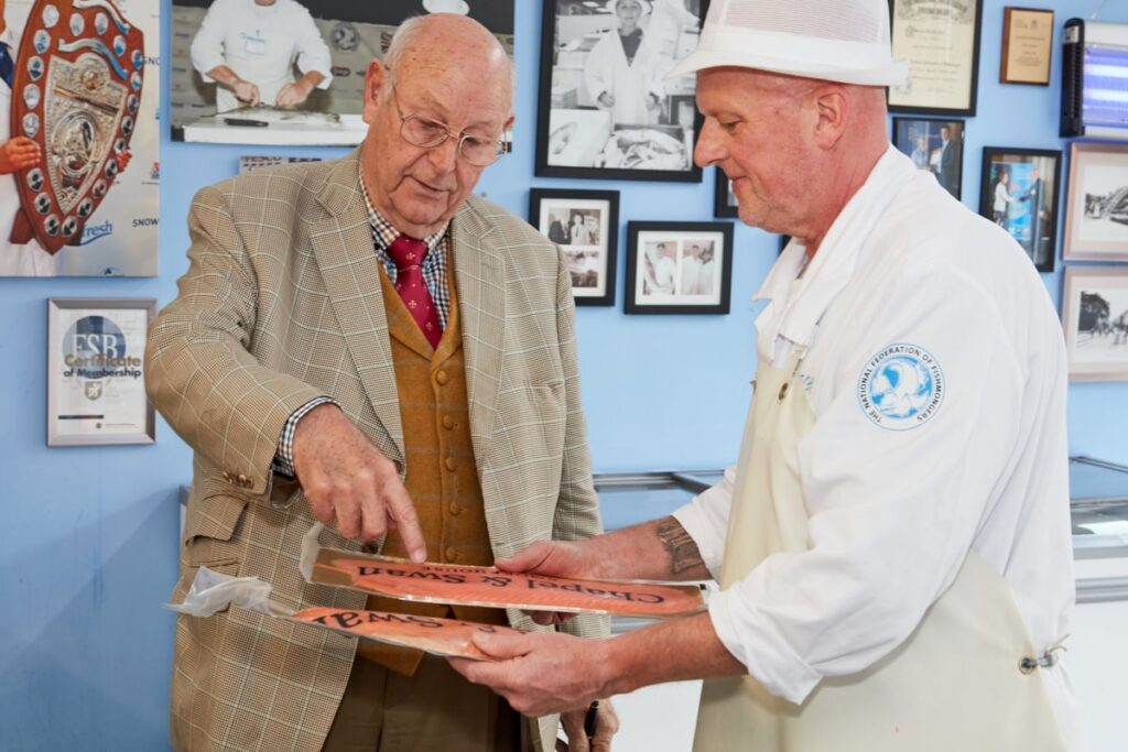 Image of a customer and fishmonger discussing fish