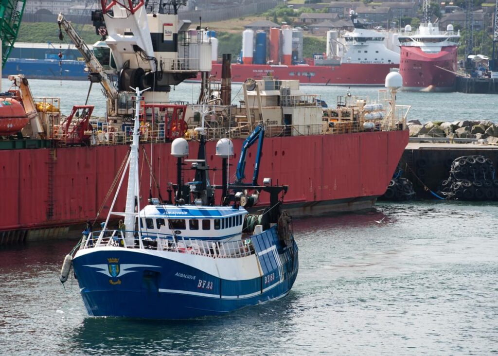 Fishing boat leaves Peterhead Harbour