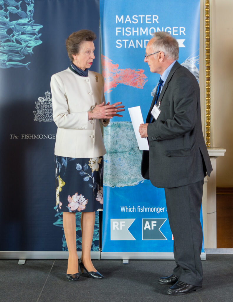 Princess Ann presents Paul Neve with a certificate